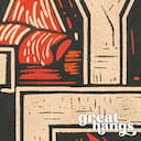 Closeup view of A vintage linocut print, the words "COZY HOME" with a fireplace