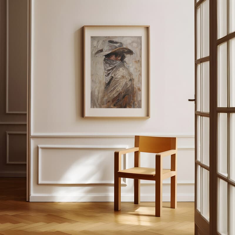 Room view with a matted frame of A vintage oil painting, man with cowboy hat bandana over his face, side view