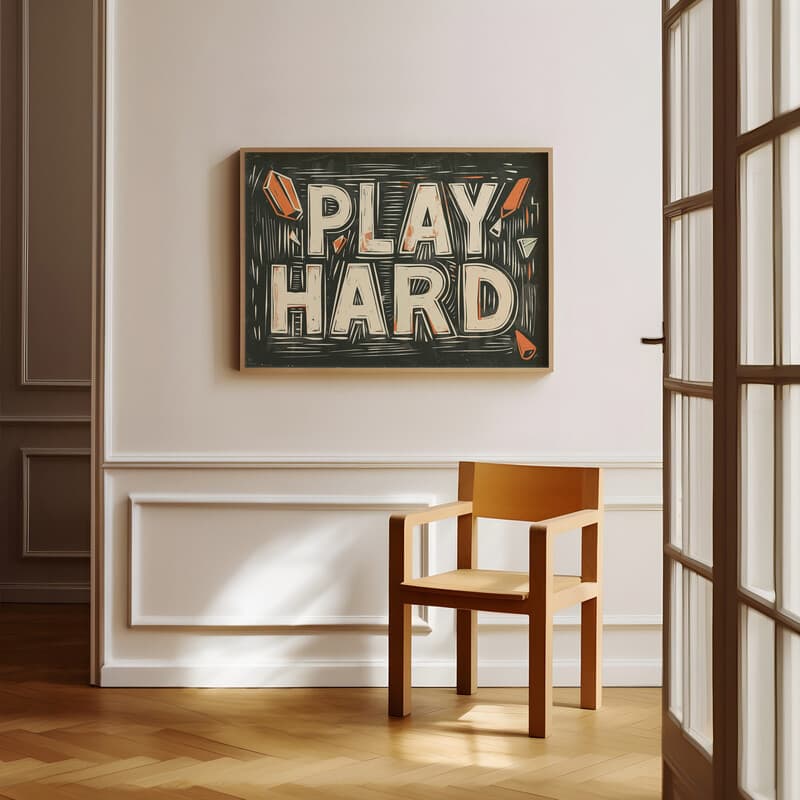 Room view with a full frame of A vintage linocut print, the words "PLAY HARD"