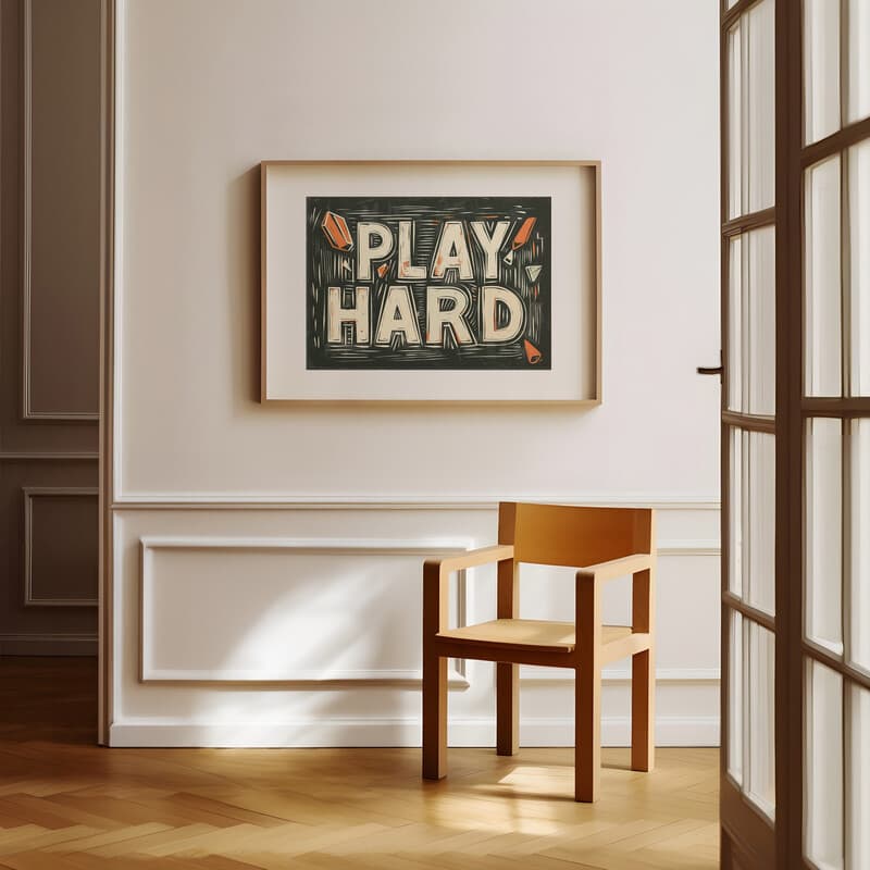 Room view with a matted frame of A vintage linocut print, the words "PLAY HARD"