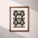 Matted frame view of A gothic textile print, symmetric skull pattern