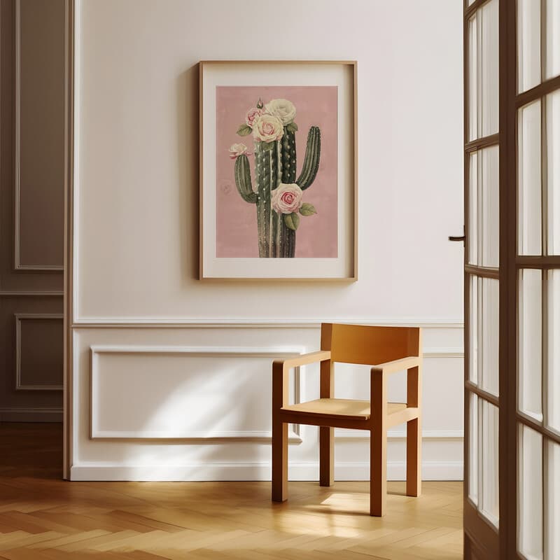 Room view with a matted frame of A vintage pastel pencil illustration, a cactus dotted with roses