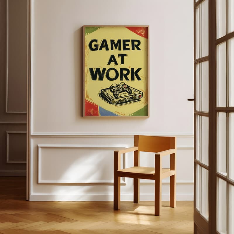 Room view with a full frame of A retro linocut print, the words "GAMER AT WORK" with a game controller