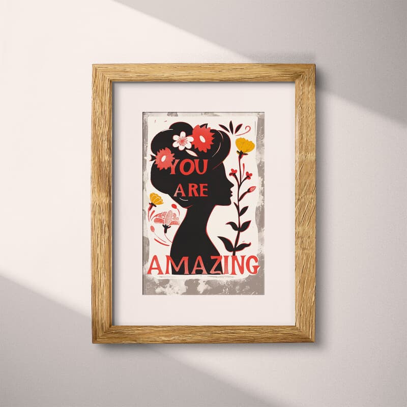 Matted frame view of A vintage linocut print, the words "YOU ARE AMAZING" with a silhouette of a woman with flowers in her hair