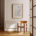 Room view with a matted frame of A mid-century graphite sketch, a barber shop chair