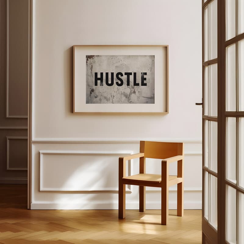 Room view with a matted frame of A minimalist poster print, the word "HUSTLE"