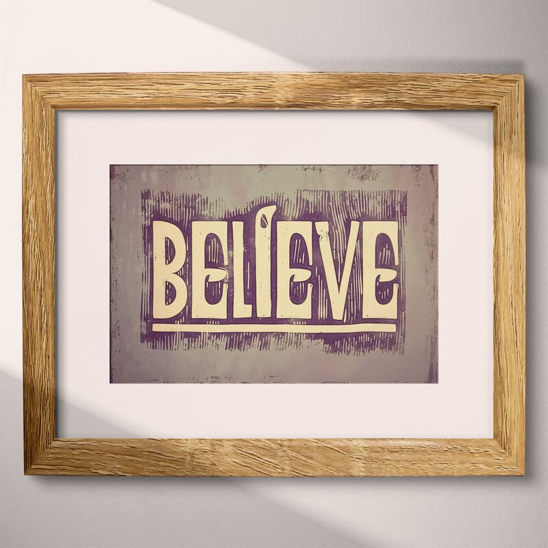 Matted frame view of A vintage linocut print, the word "BELIEVE"