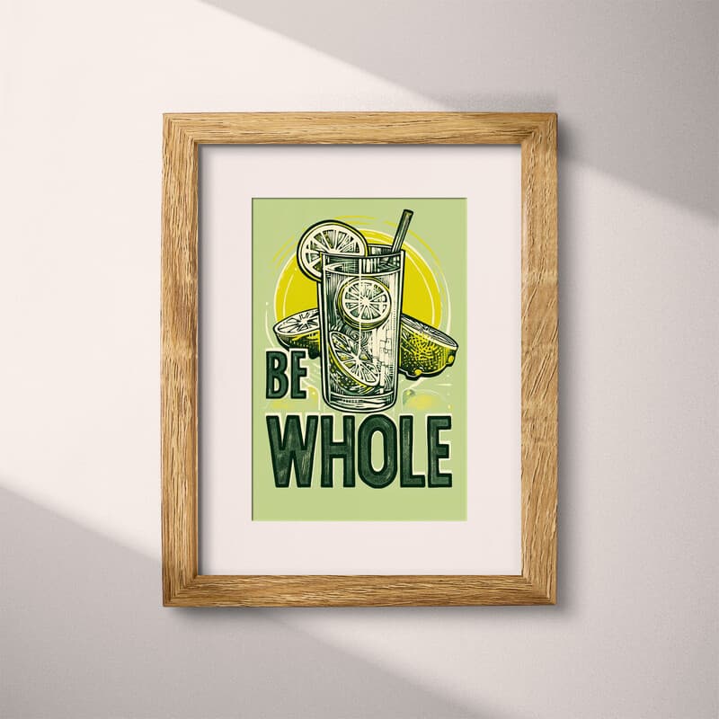 Matted frame view of A vintage linocut print, the words "BE WHOLE" with a glass of lemonade