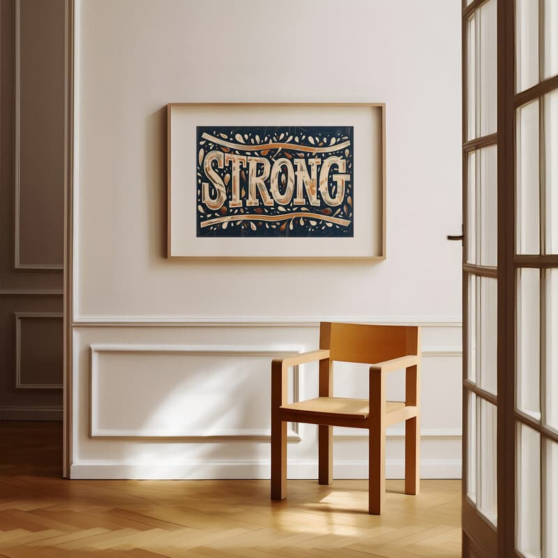 Room view with a matted frame of A retro linocut print, the word "STRONG"