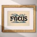 Matted frame view of A vintage linocut print, the word "FOCUS" with clouds