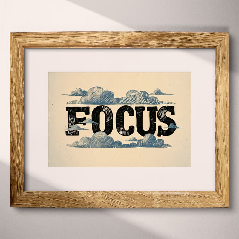 Matted frame view of A vintage linocut print, the word "FOCUS" with clouds