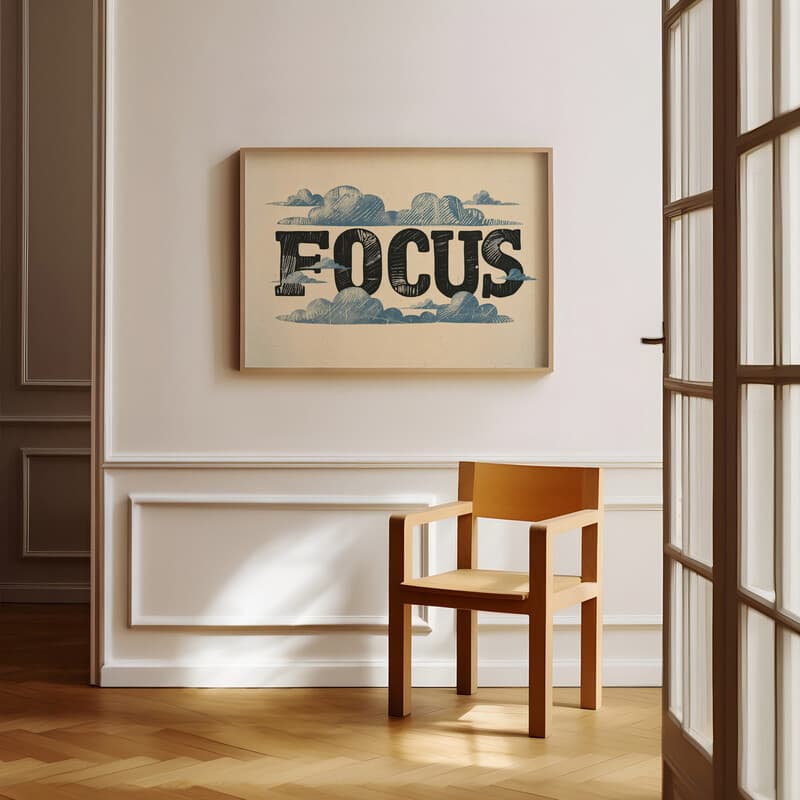 Room view with a full frame of A vintage linocut print, the word "FOCUS" with clouds