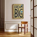 Room view with a full frame of A vintage linocut print, the words "DREAM BIG"
