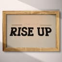 Full frame view of A retro letterpress print, the words "RISE UP"