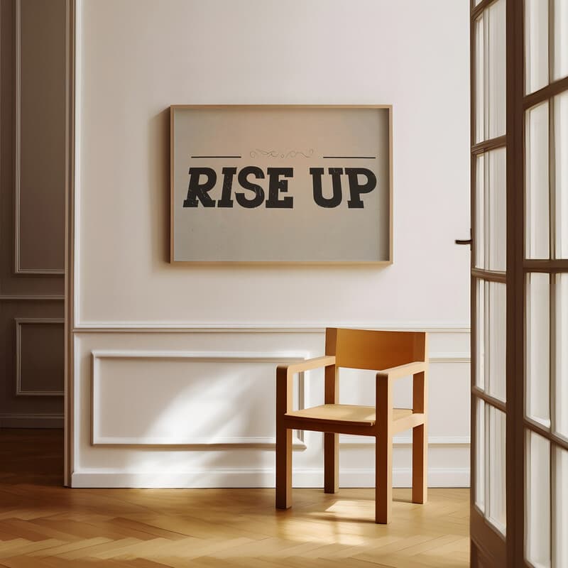 Room view with a full frame of A retro letterpress print, the words "RISE UP"
