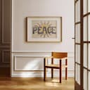 Room view with a matted frame of A vintage linocut print, the word "PEACE" with the sun