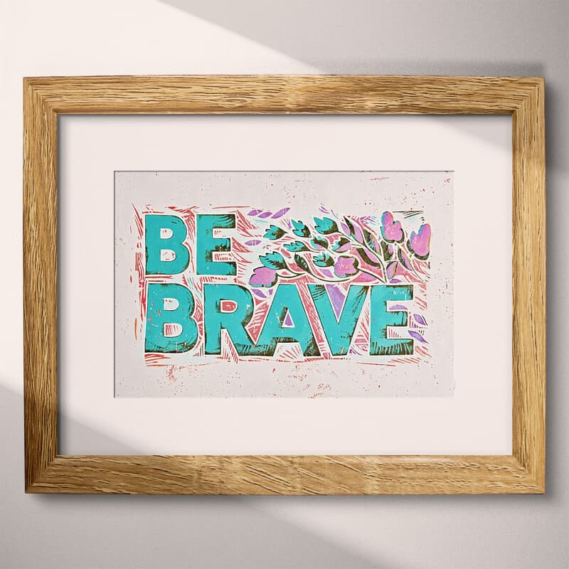Matted frame view of A bauhaus linocut print, the words "BE BRAVE"