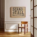 Room view with a full frame of A vintage linocut print, the words "STAND TALL" with a crown