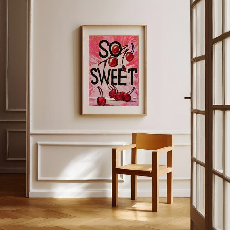 Room view with a matted frame of A vintage linocut print, the words "SO SWEET" with cherries