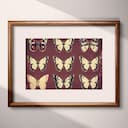 Matted frame view of A vintage linocut print, symmetric pattern of butterflies