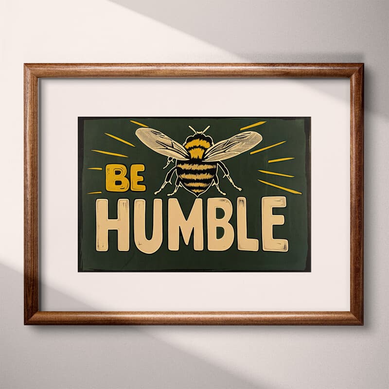 Matted frame view of A vintage linocut print, the words "BEE HUMBLE" with a bee