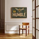 Room view with a full frame of A vintage linocut print, the words "BEE HUMBLE" with a bee