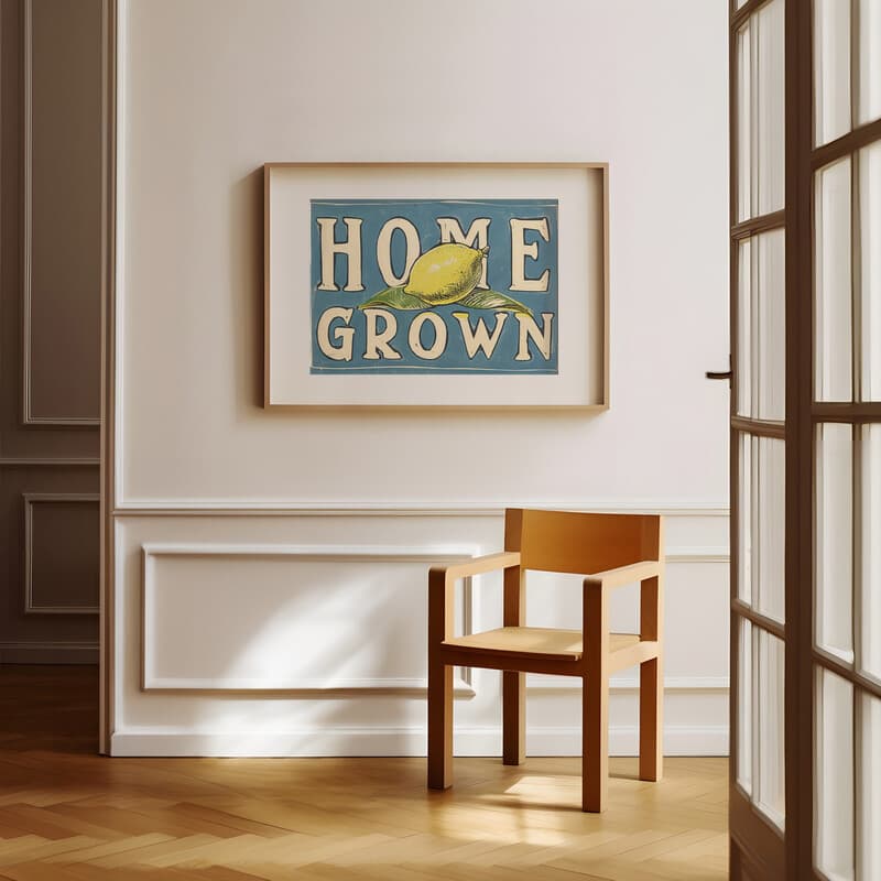 Room view with a matted frame of A vintage linocut print, the words "HOME GROWN" with a lemon