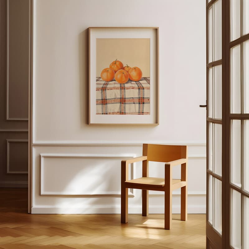 Room view with a matted frame of An art nouveau pastel pencil illustration, oranges on a checkered tablecloth