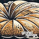 Closeup view of A vintage linocut print, the word "BAKERY" with a muffin