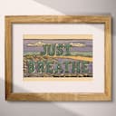 Matted frame view of A vintage linocut print, the words "JUST BREATHE" with a seashore