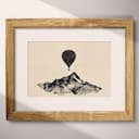 Matted frame view of A minimalist graphite sketch, a hot air balloon over a mountain