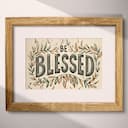 Matted frame view of A vintage linocut print, the words "BE BLESSED" with a vine