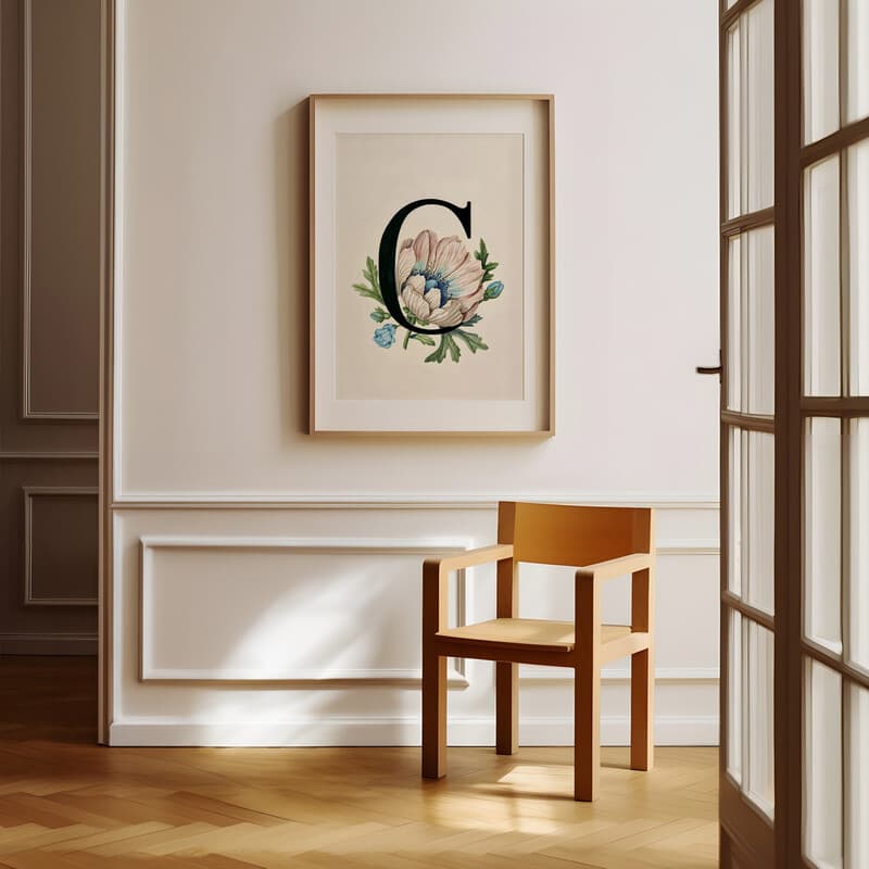 Room view with a matted frame of A vintage pastel pencil illustration, the letter "C" with a flower