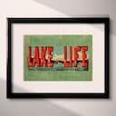 Matted frame view of A vintage linocut print, the words "LAKE LIFE" with a lake vista