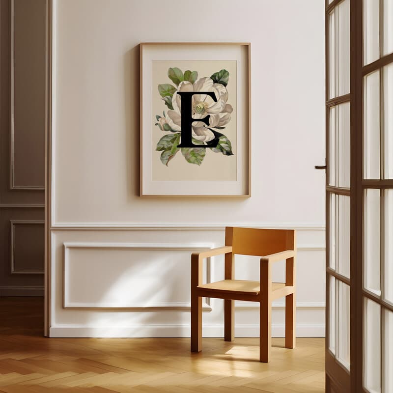 Room view with a matted frame of A vintage pastel pencil illustration, the letter "E" with a flower