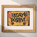 Matted frame view of A vintage linocut print, the words "STAY POSITIVE" with balloons