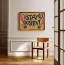 Room view with a full frame of A vintage linocut print, the words "STAY POSITIVE" with balloons