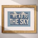 Matted frame view of A vintage linocut print, the words "HEAD TO THE SKY" with clouds