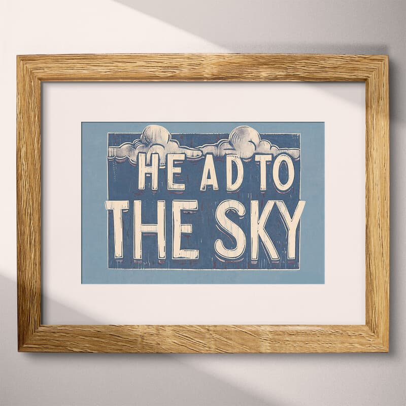 Matted frame view of A vintage linocut print, the words "HEAD TO THE SKY" with clouds