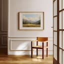 Room view with a matted frame of An impressionist oil painting, mountain valley, trees in the distance, puffy clouds