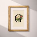 Matted frame view of A vintage pastel pencil illustration, the letter "G" with a flower