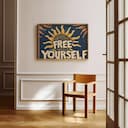 Room view with a full frame of A vintage linocut print, the words "FREE YOURSELF" with a sun