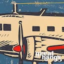 Closeup view of A vintage linocut print, the words "AIM HIGH" and an airplane