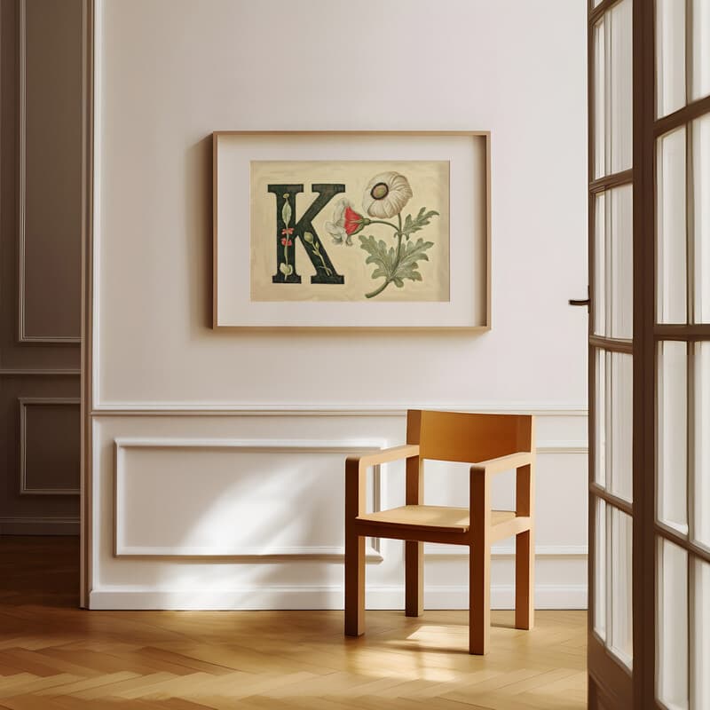 Room view with a matted frame of A vintage pastel pencil illustration, the letter "K" with a flower