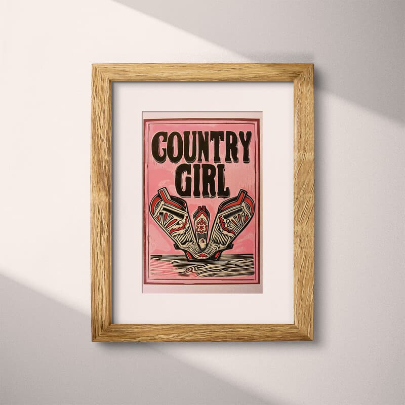 Matted frame view of A vintage linocut print, the words "COUNTRY GIRL" with cowgirl boots