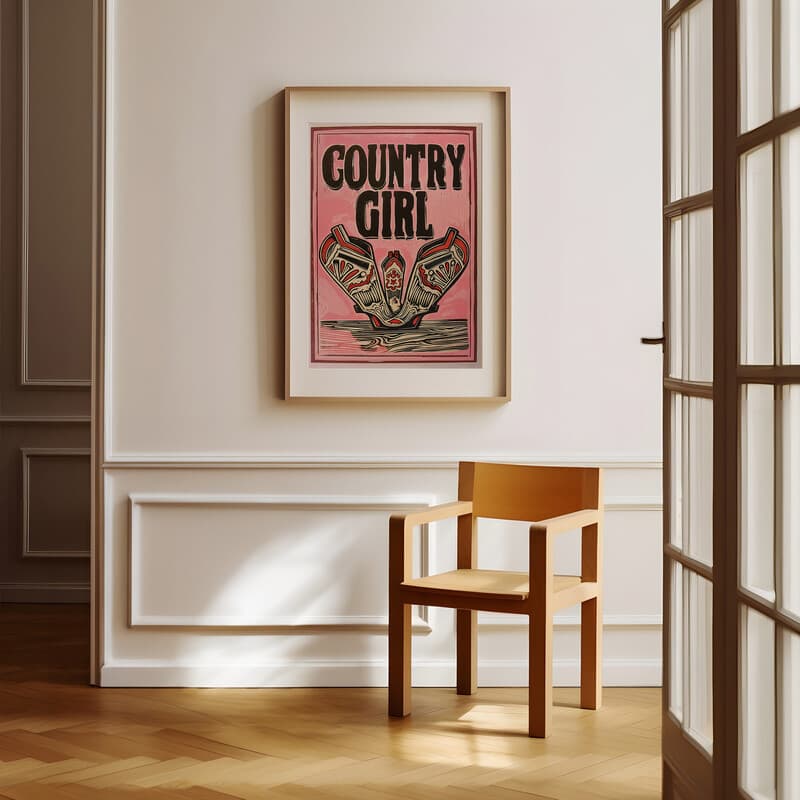 Room view with a matted frame of A vintage linocut print, the words "COUNTRY GIRL" with cowgirl boots