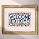 Matted frame view of A vintage linocut print, the words "WELCOME TO HOME" with flowers