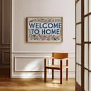 Room view with a full frame of A vintage linocut print, the words "WELCOME TO HOME" with flowers