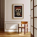 Room view with a matted frame of A gothic linocut print, a skull with a crown of flowers