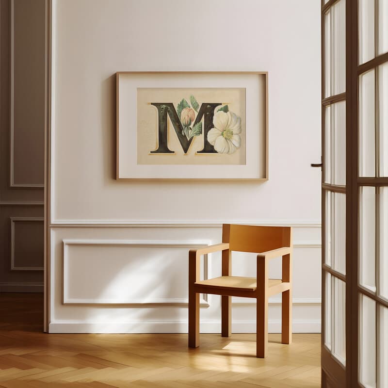 Room view with a matted frame of A vintage pastel pencil illustration, the letter "M" with a flower